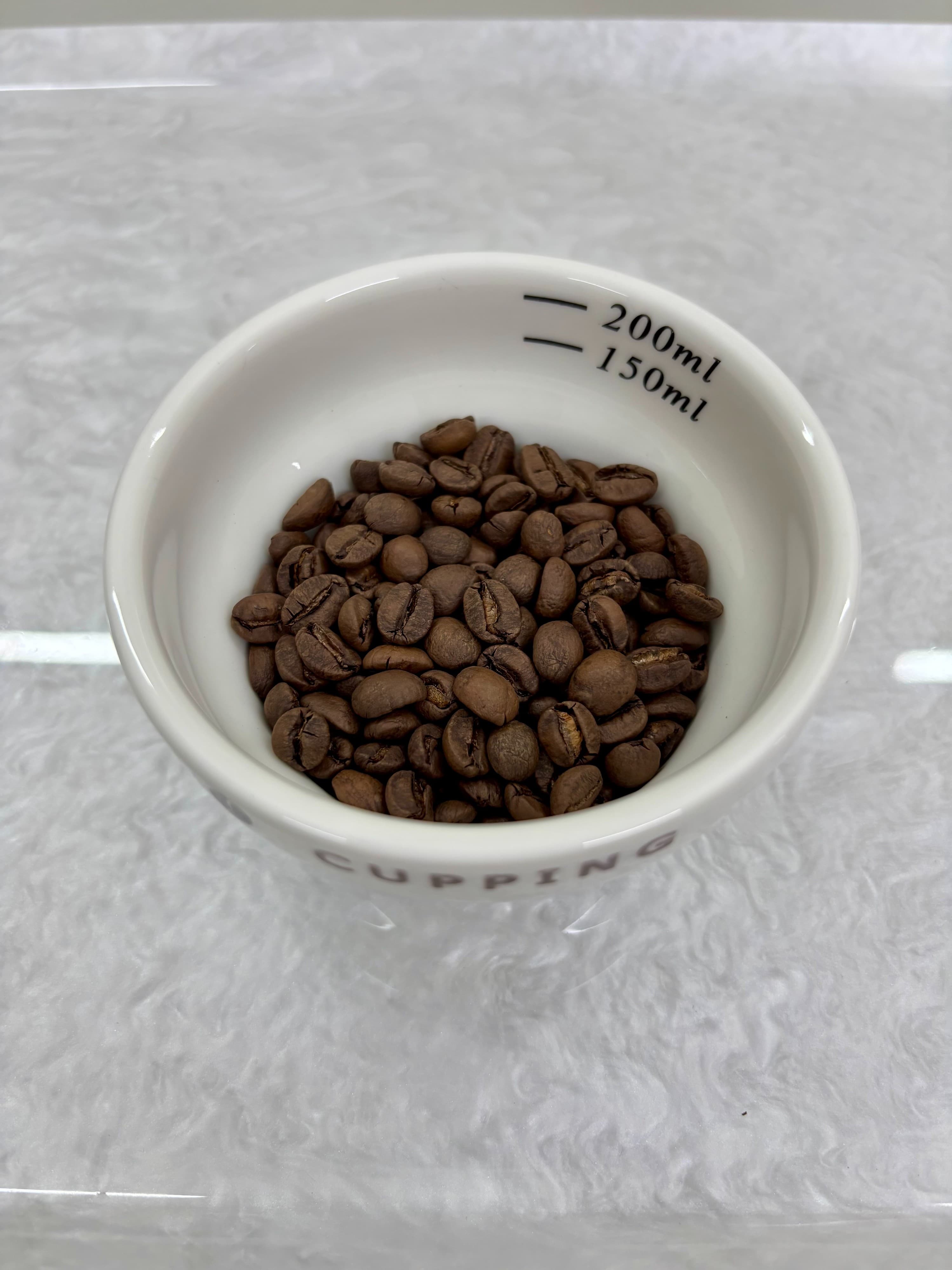 Roasted Maison Specialty coffee beans in a cupping bowl